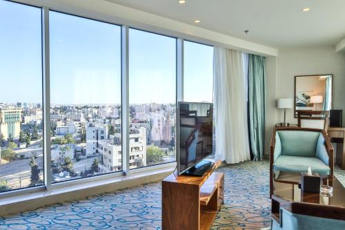 a hotel room with a view of a city at Coral Tower Hotel by Hansa in Amman