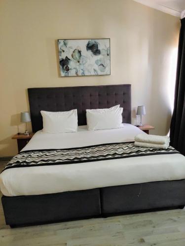 Voodi või voodid majutusasutuse Prime Hotel toas