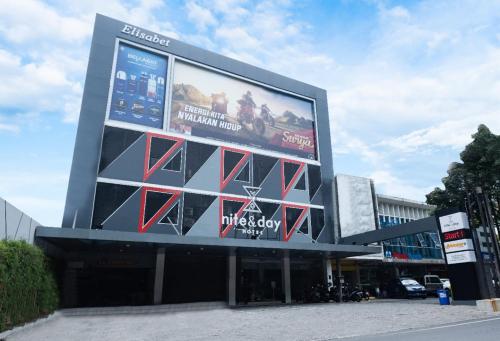 a large billboard on the side of a building at Nite & Day Semarang - Candi in Semarang