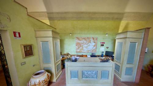 a large kitchen with a counter in a room at Monastero Le Grazie in Amelia