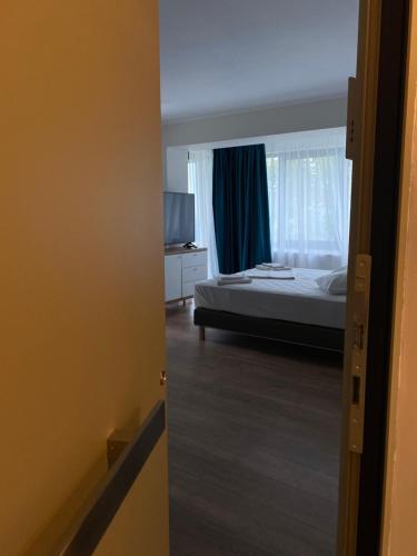 Ένα ή περισσότερα κρεβάτια σε δωμάτιο στο Oliv Residence