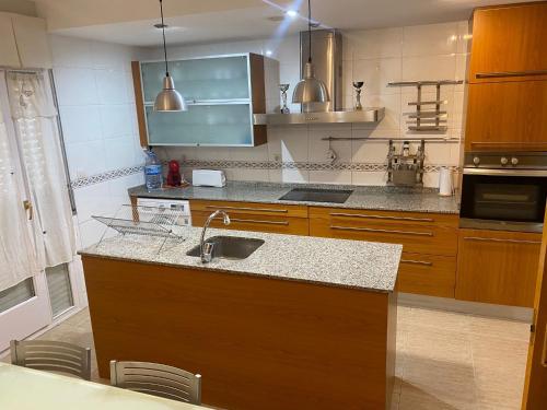 a kitchen with a sink and a counter top at MEQUEDO GRAN CAMINANTE in Alcañiz