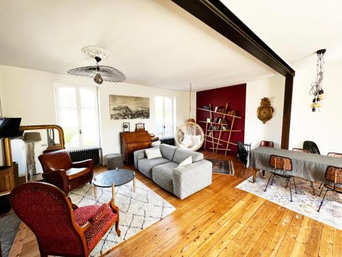 a living room with a couch and a table at Villa Sainte Claire in Saint Malo