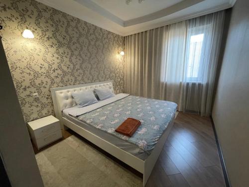 Postel nebo postele na pokoji v ubytování Роща 7