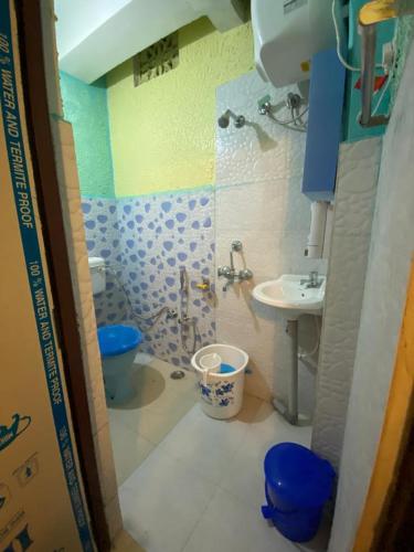 a small bathroom with a sink and a toilet at MAMTA HOMESTAY in Darjeeling