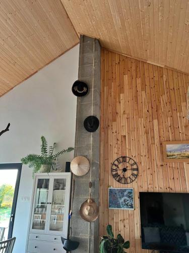 a kitchen with wooden walls and a ceiling at Houses with a View#Sauna#Jaccuzi in Gozdowice