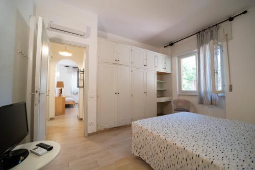 Ein Bett oder Betten in einem Zimmer der Unterkunft Residence Capobianco