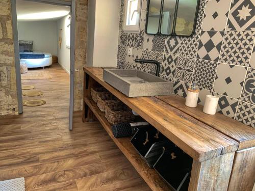 a bathroom with a wooden counter with a sink at The Loft Factory 4 Chambres Vue Garonne + Jardin in Lormont