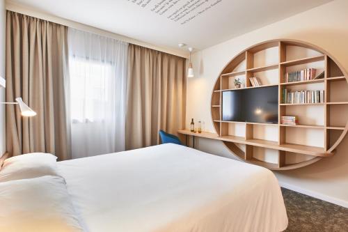 Ένα ή περισσότερα κρεβάτια σε δωμάτιο στο ibis Styles La Roche-sur-Yon