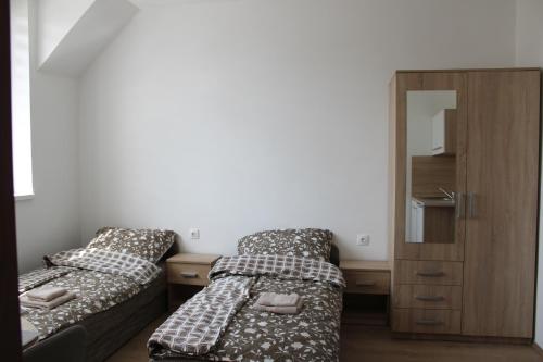 En eller flere senge i et værelse på Szikla Vendégház Sopron