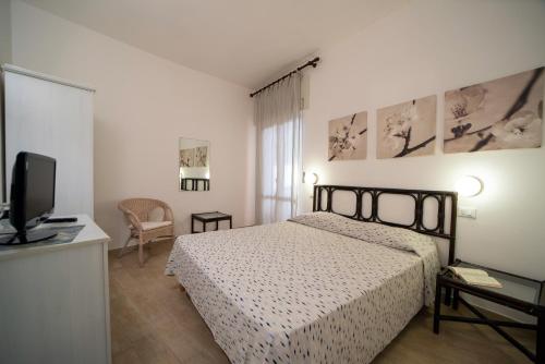 Ein Bett oder Betten in einem Zimmer der Unterkunft Residence Capobianco