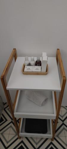a white table with a box on top of it at Guest Home location in Néris-les-Bains