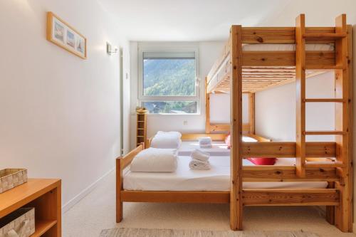 a bedroom with two bunk beds and a ladder at Résidence La Vallée Blanche - Happy Rentals in Chamonix-Mont-Blanc