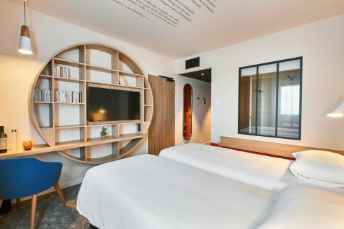 Ένα ή περισσότερα κρεβάτια σε δωμάτιο στο ibis Styles La Roche-sur-Yon