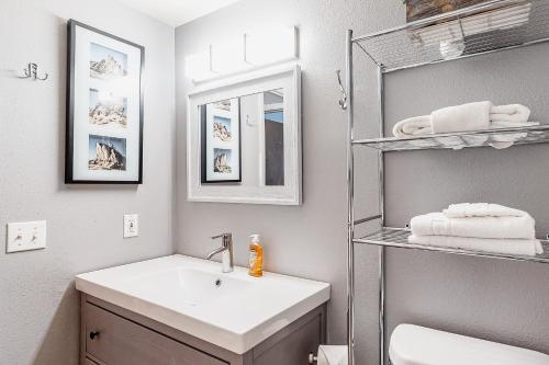 a bathroom with a sink and a mirror at Hi Country 811 in Winter Park
