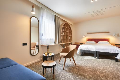 Ένα ή περισσότερα κρεβάτια σε δωμάτιο στο ibis Styles La Roche-sur-Yon
