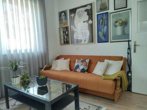 a living room with a couch and a table at Katerina's Apartment in Bitola