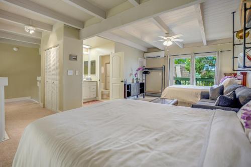 a large bedroom with a bed and a couch at Puamana 9B in Princeville