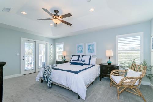 a bedroom with a bed and a ceiling fan at Near The Mayo Clinic 2 Blocks From Ocean 4 Bedroom Pet Friendly Home in Jacksonville Beach
