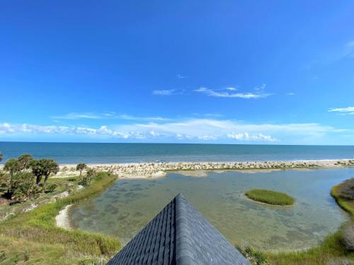a view of the beach from the balcony of a house at Lookout Point in Edisto Island