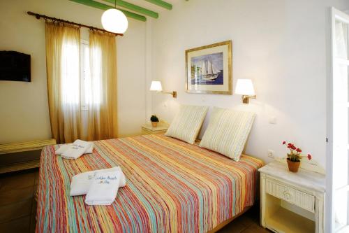 Letto o letti in una camera di Golden Beach Studios & Suites