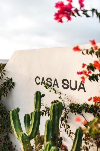 a sign that reads casa suva with a cactus at Casa Sua in Famara