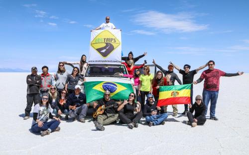 a group of people posing for a picture on the beach at Casa Ecotrips Barra Funda - Hostel in Sao Paulo