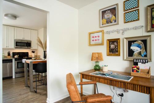 a kitchen and dining room with a table and chairs at Abode Nashville - Marathon Village Near Downtown in Nashville