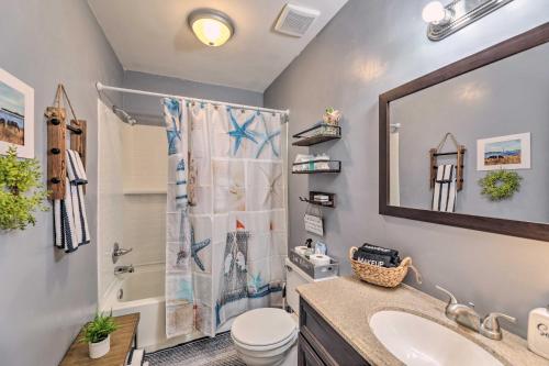 a bathroom with a shower and a sink and a toilet at Swansboro Coastal Home Less Than 3 Mi to State Park! in Swansboro