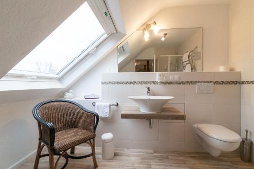 a bathroom with a sink and a mirror at Thermen Hotel & Restaurant Bad Soden in Bad Soden am Taunus