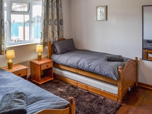 a bedroom with two beds and a window at The Shanty in Walcott