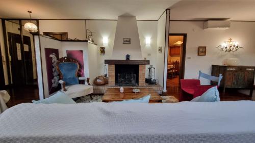 a bedroom with a bed and a fireplace at Ospitale 7 in Trieste