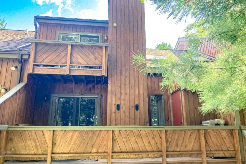 a wooden house with a fence in front of it at Big Boulder Bliss in Lake Harmony