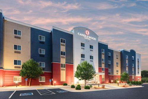 a rendering of a building with a cinnabon hotel at Candlewood Suites Grand Junction by IHG in Grand Junction