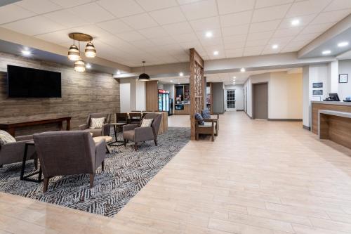 a lobby of a hospital with chairs and a tv at Candlewood Suites Grand Junction by IHG in Grand Junction