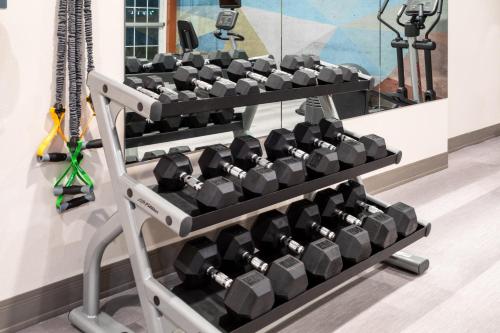 a rack of dumbbells in a gym at Candlewood Suites Grand Junction by IHG in Grand Junction