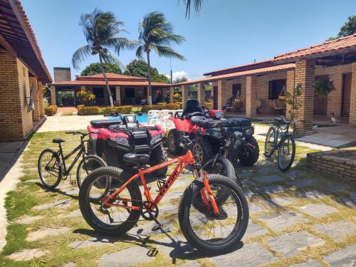 a group of bikes parked in front of a building at Pousada Solar das Fontes in Beberibe