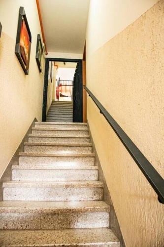 a stairway leading up to a building with stairs at Hermoso Depto en Calle Palma Asunción 290 m2 - Centro Histórico de Asunción in Asuncion