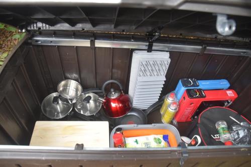 a drawer filled with utensils and other items in a car at Gypsy Sunrose in Bude