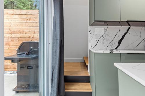 a kitchen with a sink and a counter at Les Petits Chalets in Val-des-Lacs