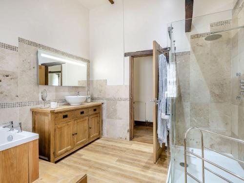 a bathroom with a sink and a shower and a mirror at High House Barn - Uk36929 in Foulsham