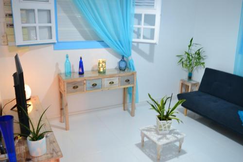 Ruang duduk di Les Villas du Bambou - Appartement AZUL de 1 à 3 pers