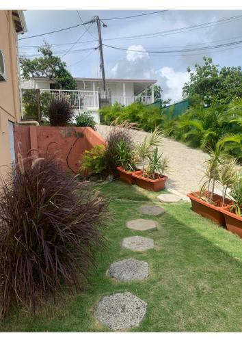 Taman di luar Les Villas du Bambou - Appartement AZUL de 1 à 3 pers