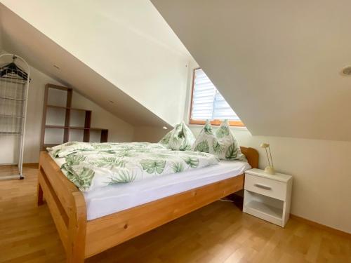 a bedroom with a bed in a attic at Ferienwohnung Stadlmann in Ebensee