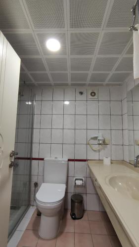 a bathroom with a toilet and a sink at Wonder Life Hotel in Side