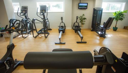 a gym with several exercise bikes in a room at Bells Hotel in Coleford