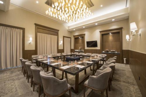 a large conference room with a long table and chairs at Fiesta Americana Merida in Mérida