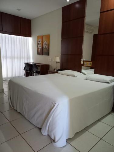Katil atau katil-katil dalam bilik di Ibituruna Center Hotel