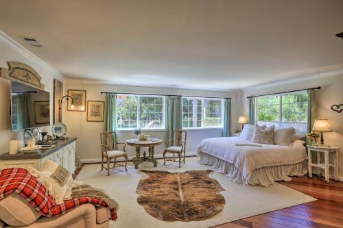 a bedroom with a bed and a table and chairs at Peaceful Ranch Resort and Vineyard View, Pool Access in Solvang