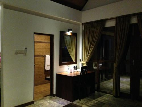 a bathroom with a sink and a mirror at Laya Safari Resorts & Spa in Yala